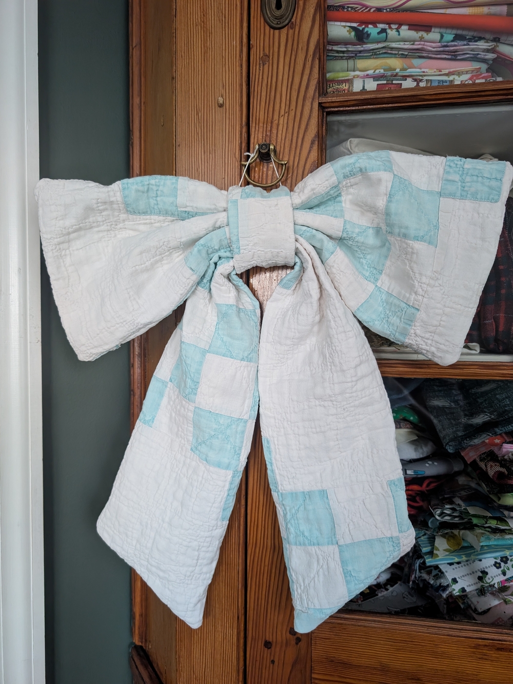Handmade White and Light Blue Patchwork Quilt Bow Accent